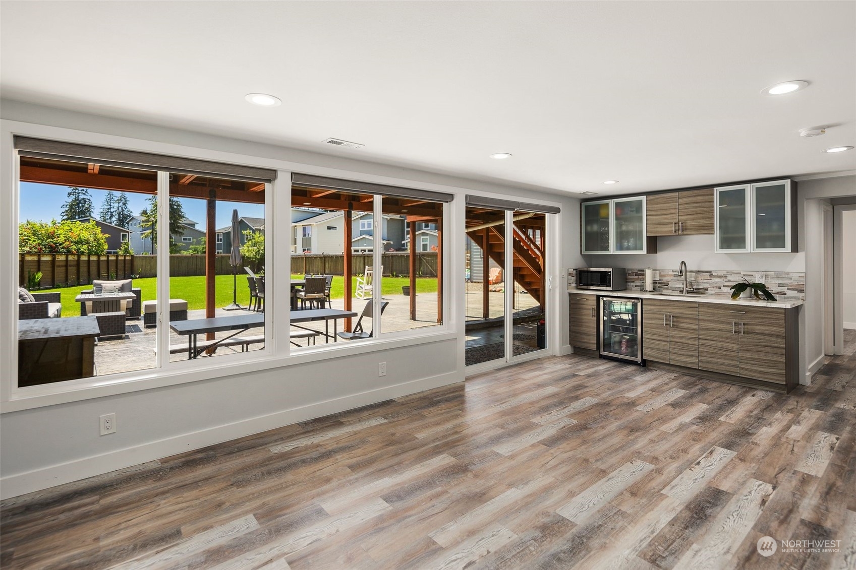 102 Bellflower Road Bothell, WA 98012 - Photo 18 of 40 a view of a kitchen with furniture and large windows