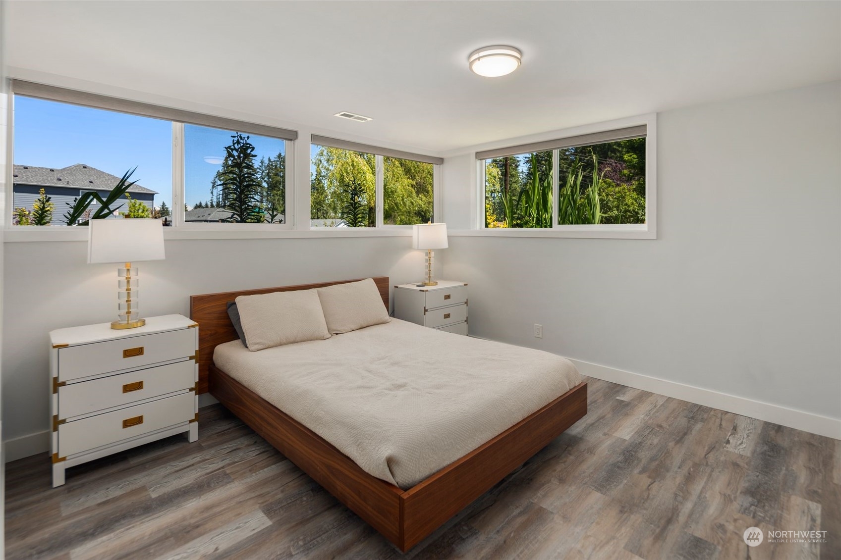 102 Bellflower Road Bothell, WA 98012 - Photo 21 of 40 a large bed sitting in a bedroom next to a window