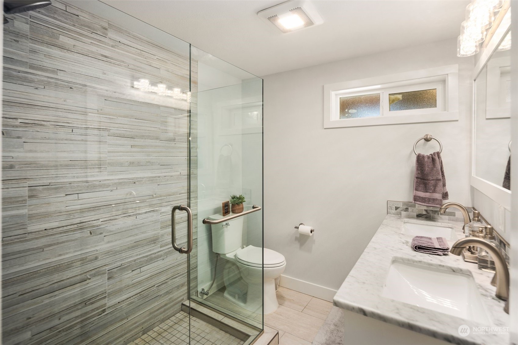 102 Bellflower Road Bothell, WA 98012 - Photo 22 of 40 a bathroom with a sink a toilet and shower