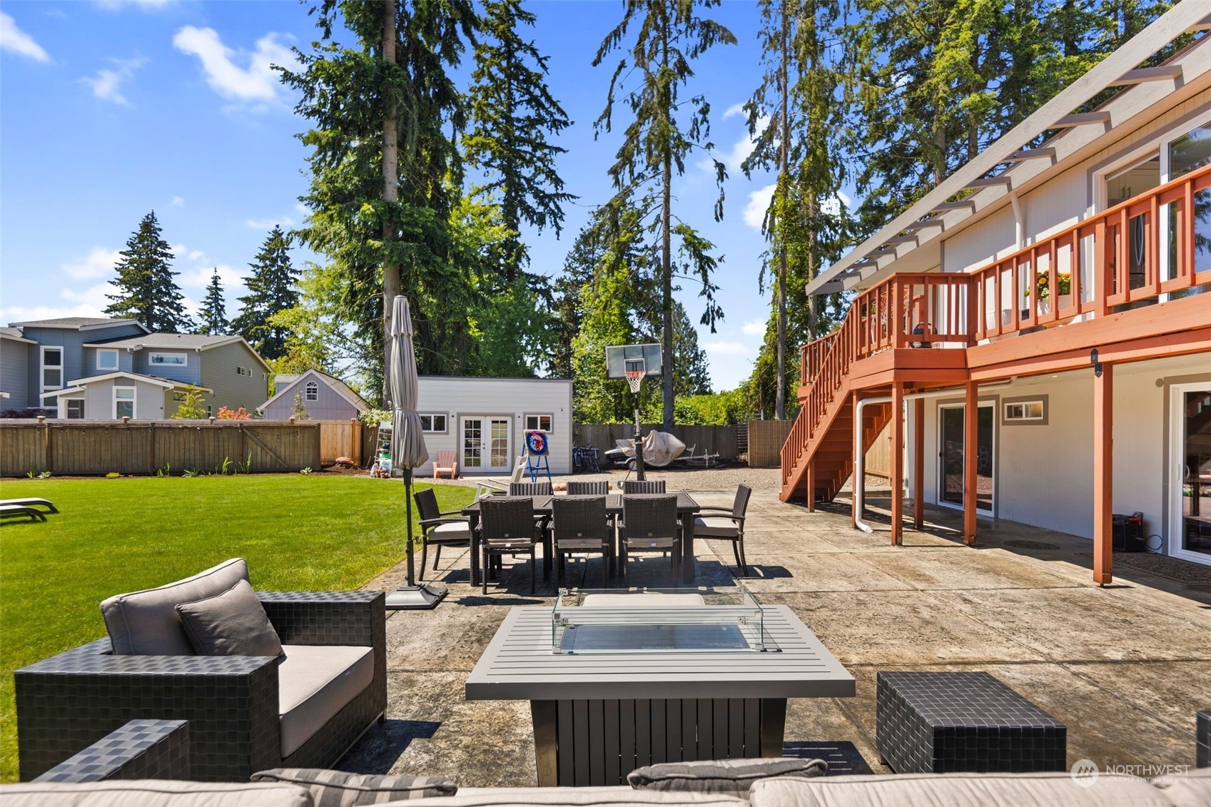 102 Bellflower Road Bothell, WA 98012 - Photo 26 of 40 a view of a house with backyard sitting area and garden