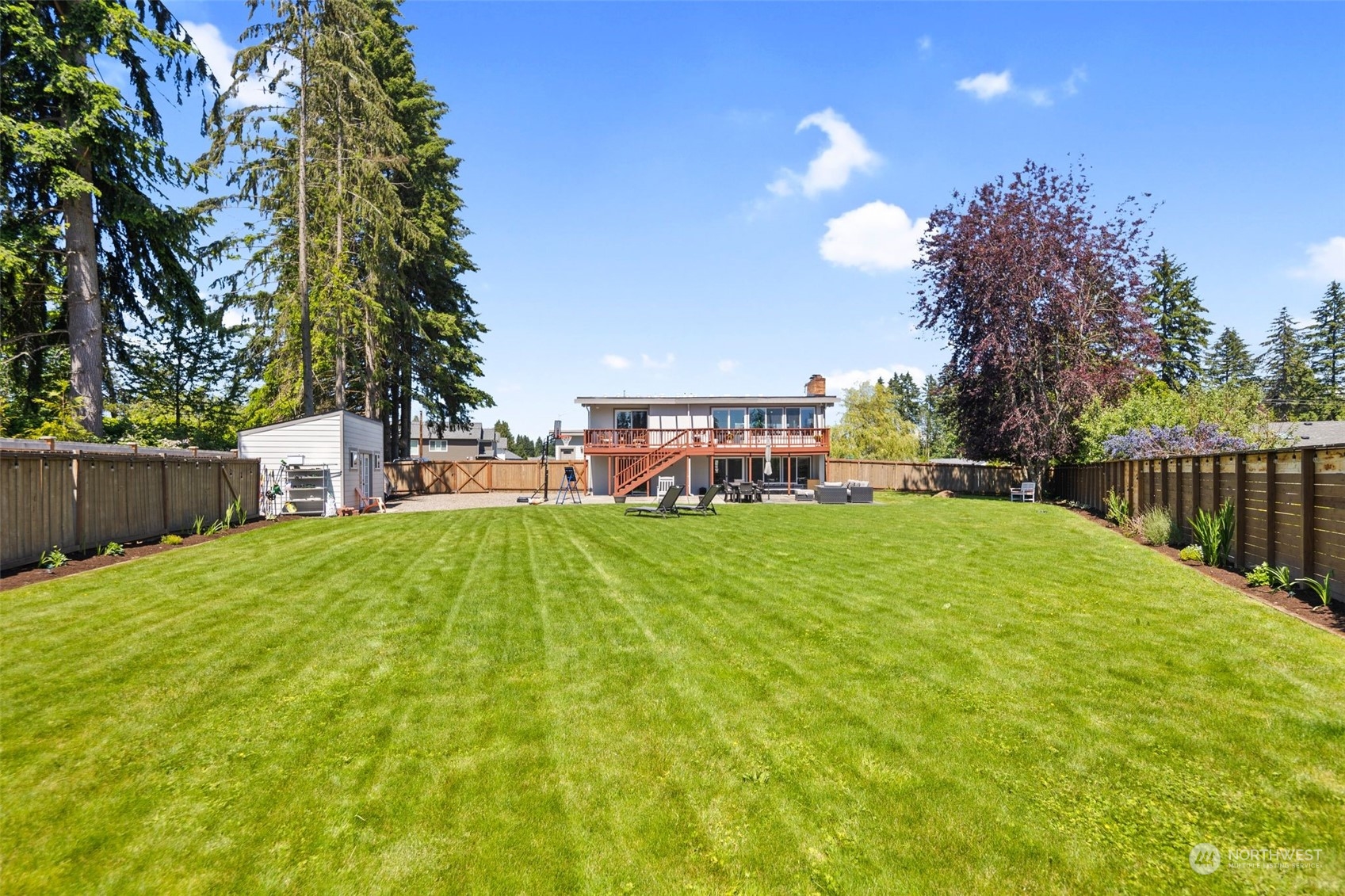 102 Bellflower Road Bothell, WA 98012 - Photo 27 of 40 a view of a swimming pool with a patio