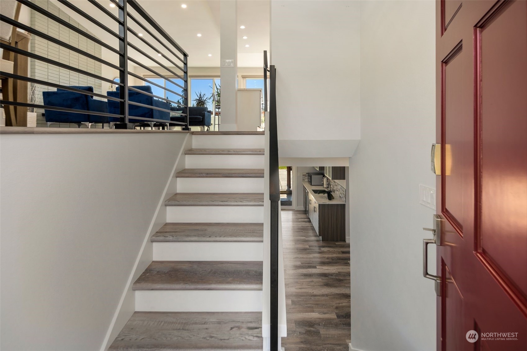 102 Bellflower Road Bothell, WA 98012 - Photo 3 of 40 a view of staircase with white walls and railing