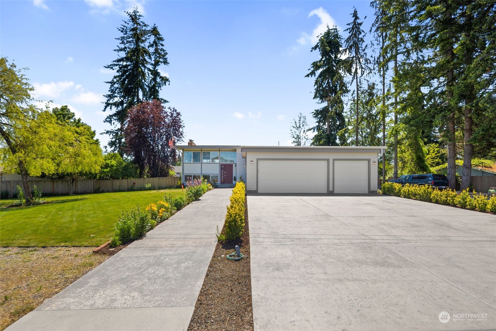 102 Bellflower Road Bothell, WA 98012 - Photo 33 of 40 a front view of house with a yard and trees all around