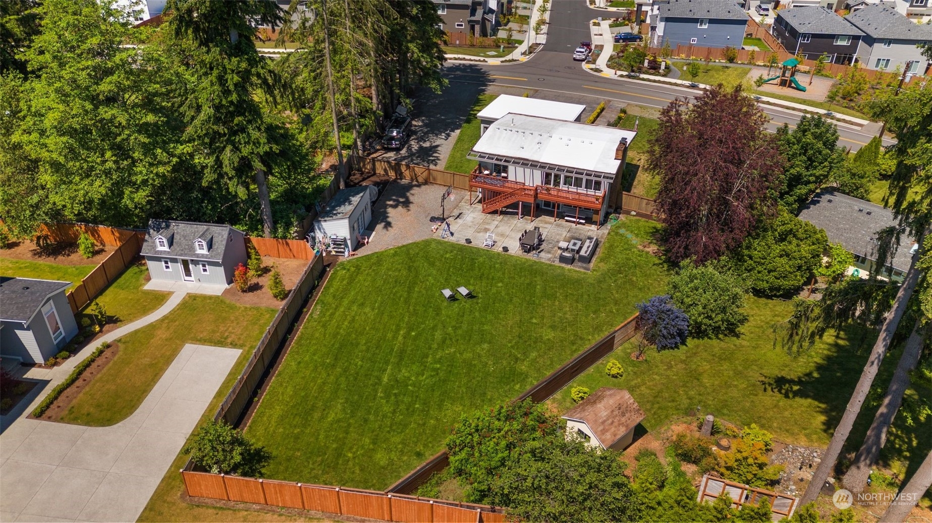 102 Bellflower Road Bothell, WA 98012 - Photo 37 of 40 an aerial view of a house with garden space sitting space and swimming pool