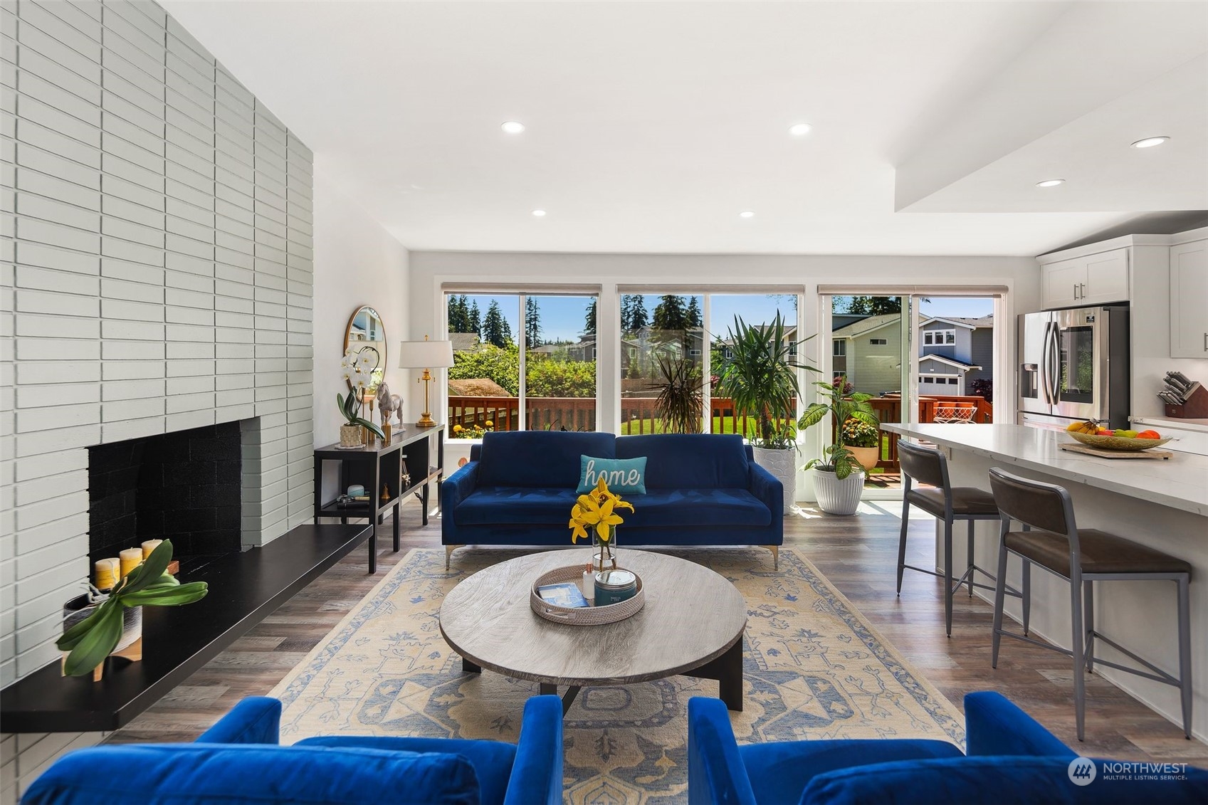 102 Bellflower Road Bothell, WA 98012 - Photo 5 of 40 a living room with furniture and a fireplace