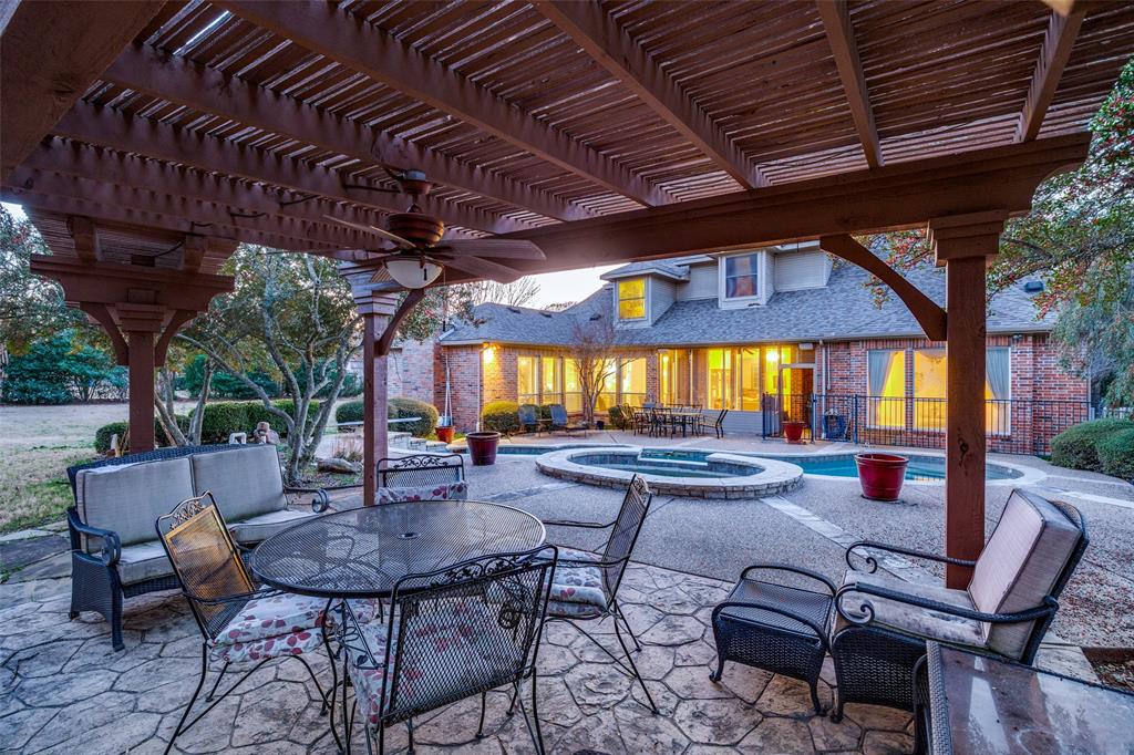 390 Oak Ridge Drive Fairview, TX 75069 - Photo 11 of 12 a building outdoor space with patio furniture and potted plants