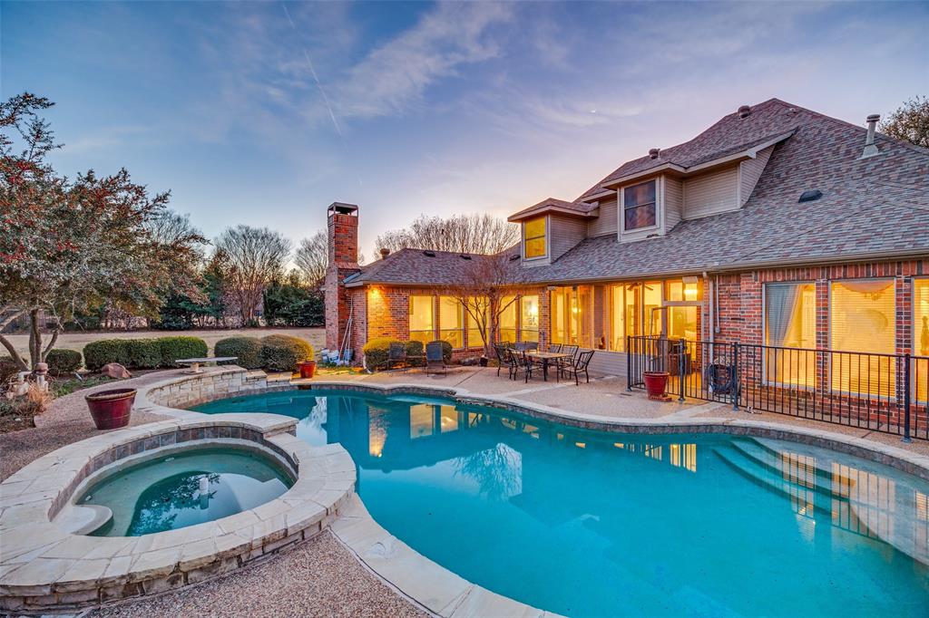 390 Oak Ridge Drive Fairview, TX 75069 - Photo 10 of 12 a view of a house with swimming pool and sitting area