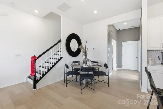 a living room with furniture a rug and a flat screen tv