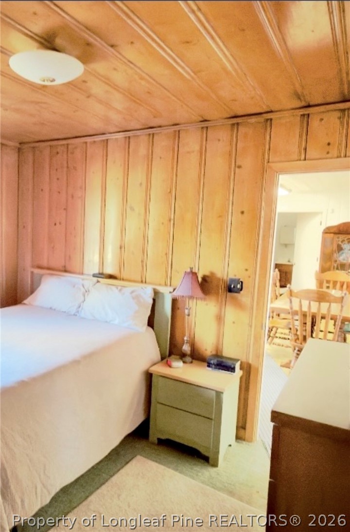 5309 Tobacco Road Orrum, NC 28369 - Photo 14 of 44 a bedroom with a bed and a night stand