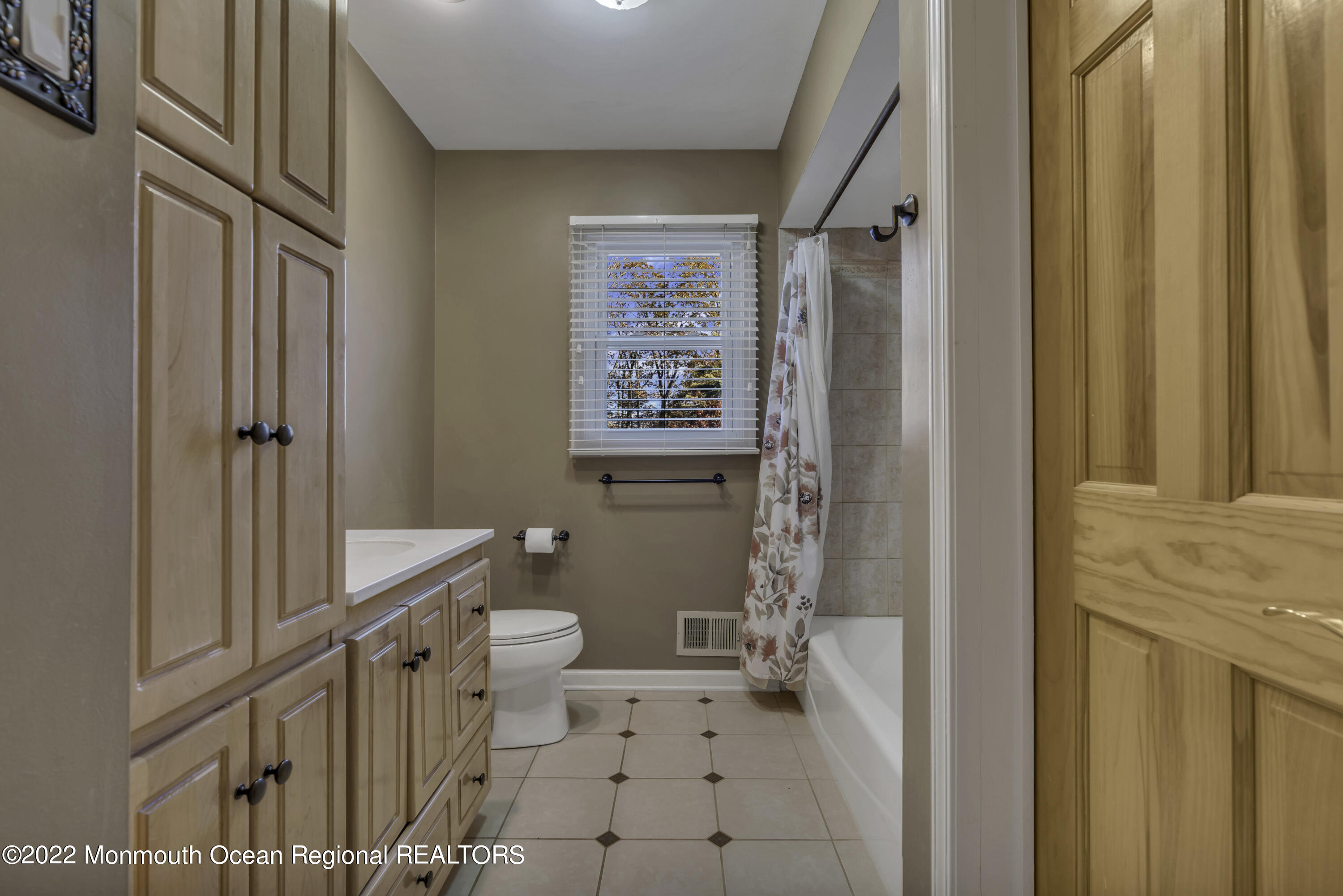 115 Greymoor Road Howell, NJ 07731 - Photo 12 of 38 a bathroom with a toilet a sink and a shower