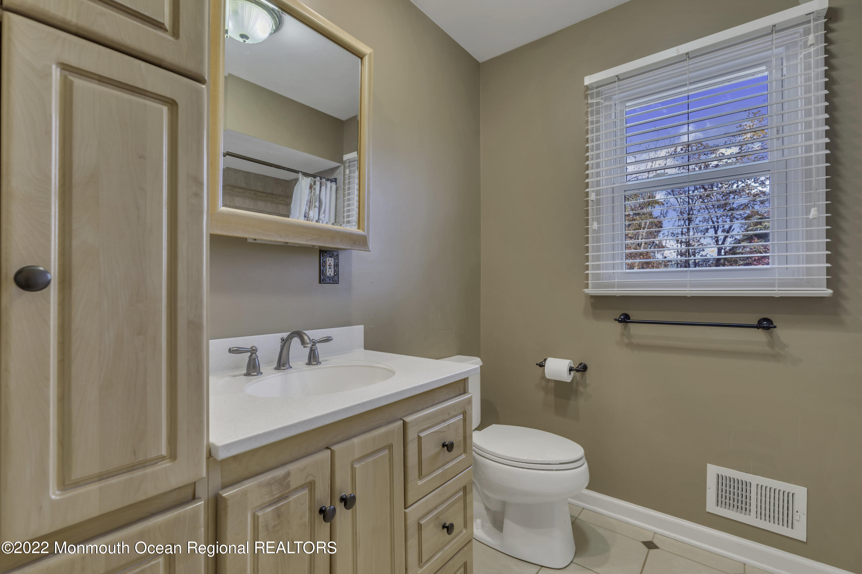 115 Greymoor Road Howell, NJ 07731 - Photo 13 of 38 a bathroom with a toilet a sink and mirror
