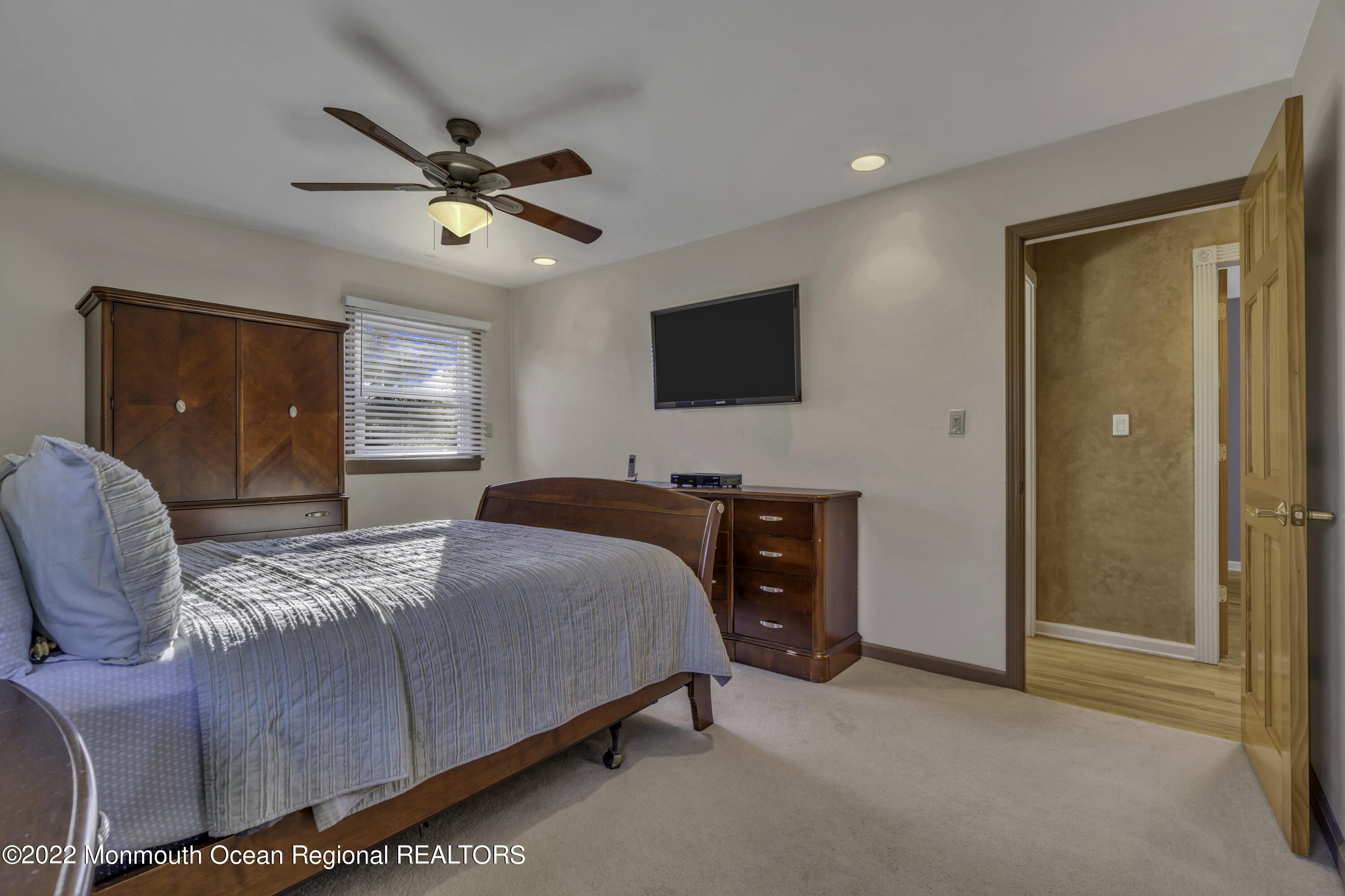 115 Greymoor Road Howell, NJ 07731 - Photo 16 of 38 a bedroom with a bed and a flat screen tv