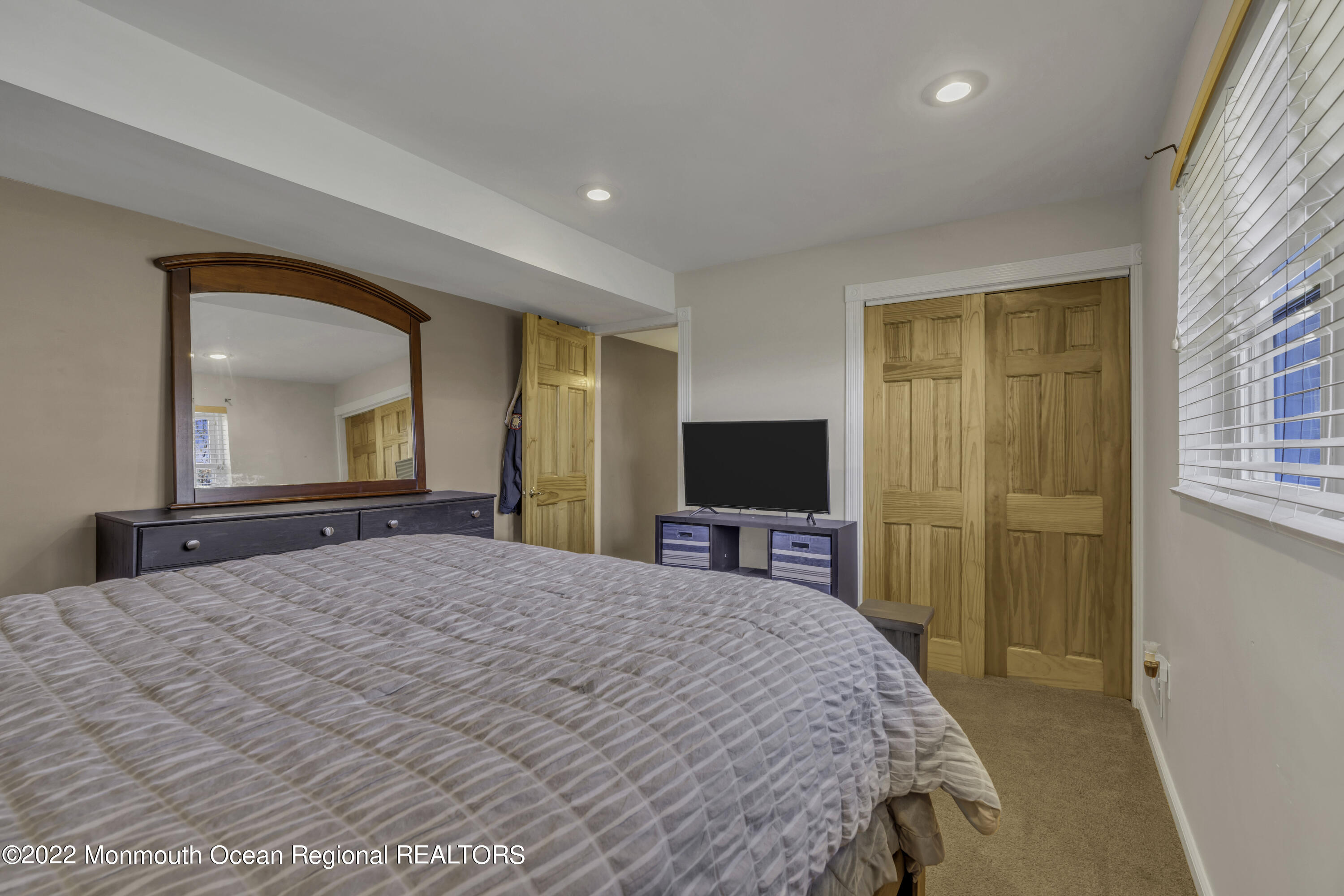 115 Greymoor Road Howell, NJ 07731 - Photo 23 of 38 a bedroom with a bed and a flat screen tv