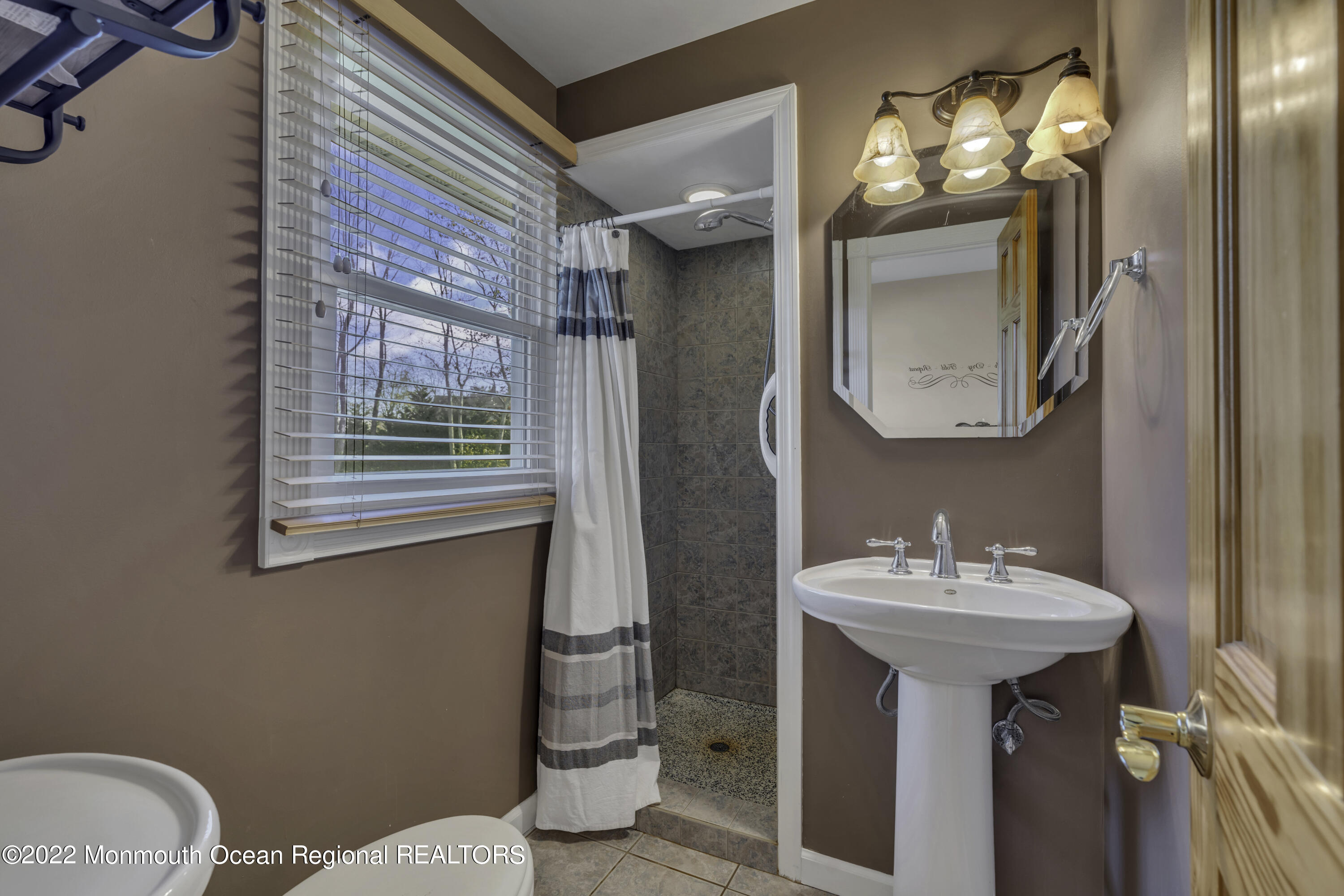115 Greymoor Road Howell, NJ 07731 - Photo 25 of 38 a bathroom with a sink toilet and mirror