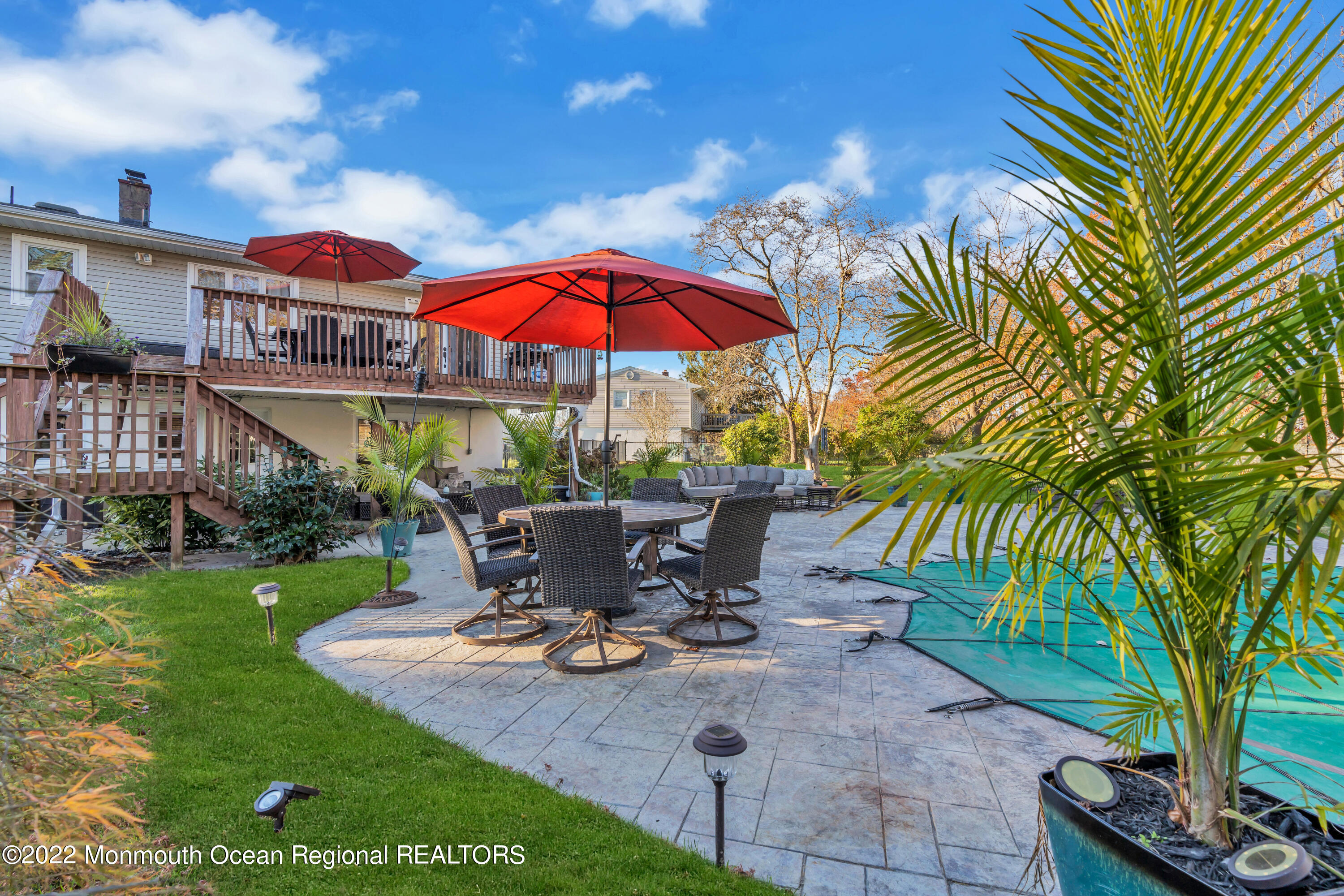 115 Greymoor Road Howell, NJ 07731 - Photo 29 of 38 a view of a tables and chairs under an umbrella