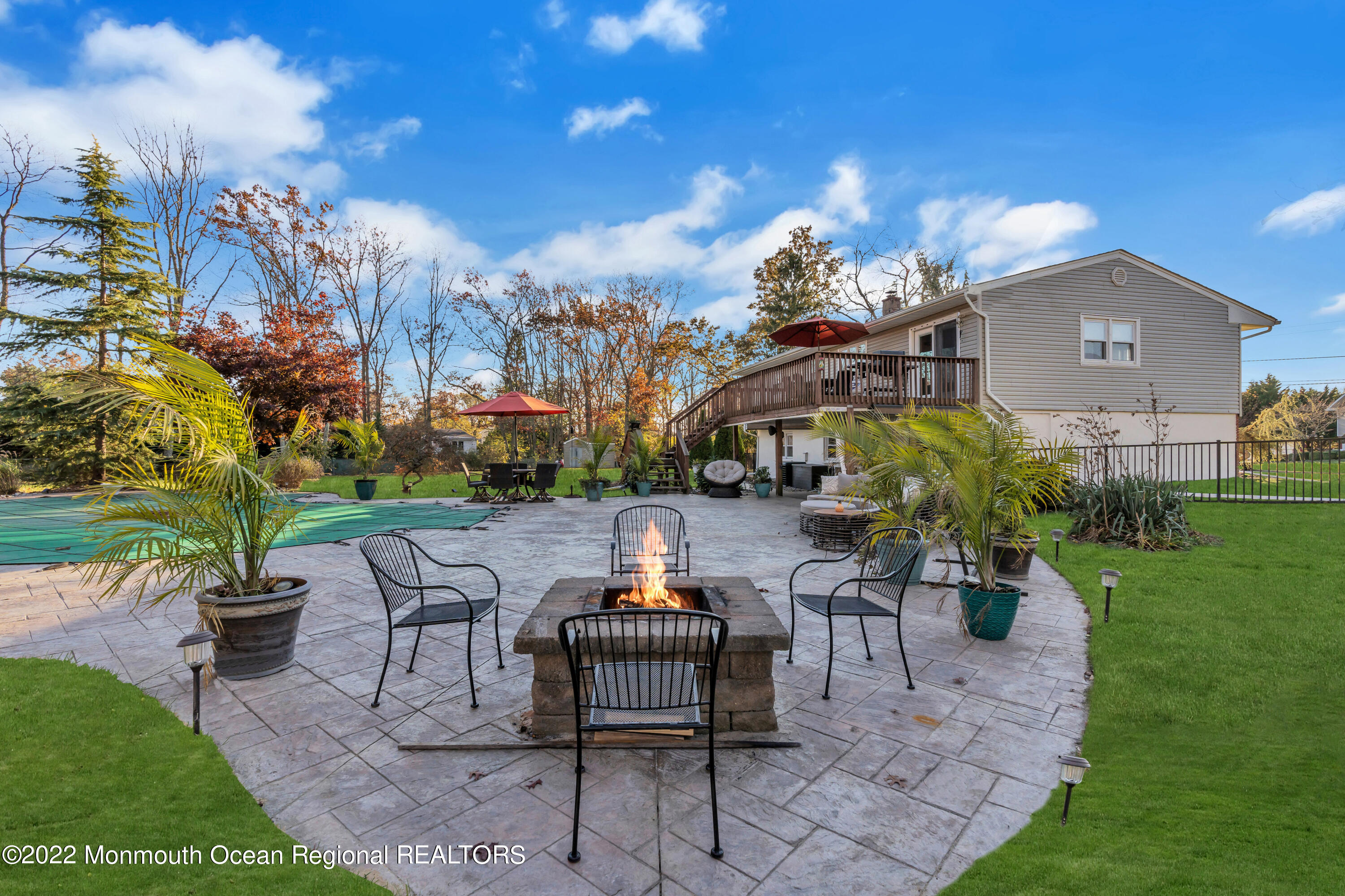 115 Greymoor Road Howell, NJ 07731 - Photo 30 of 38 a view of a patio with couches table and chairs and potted plants