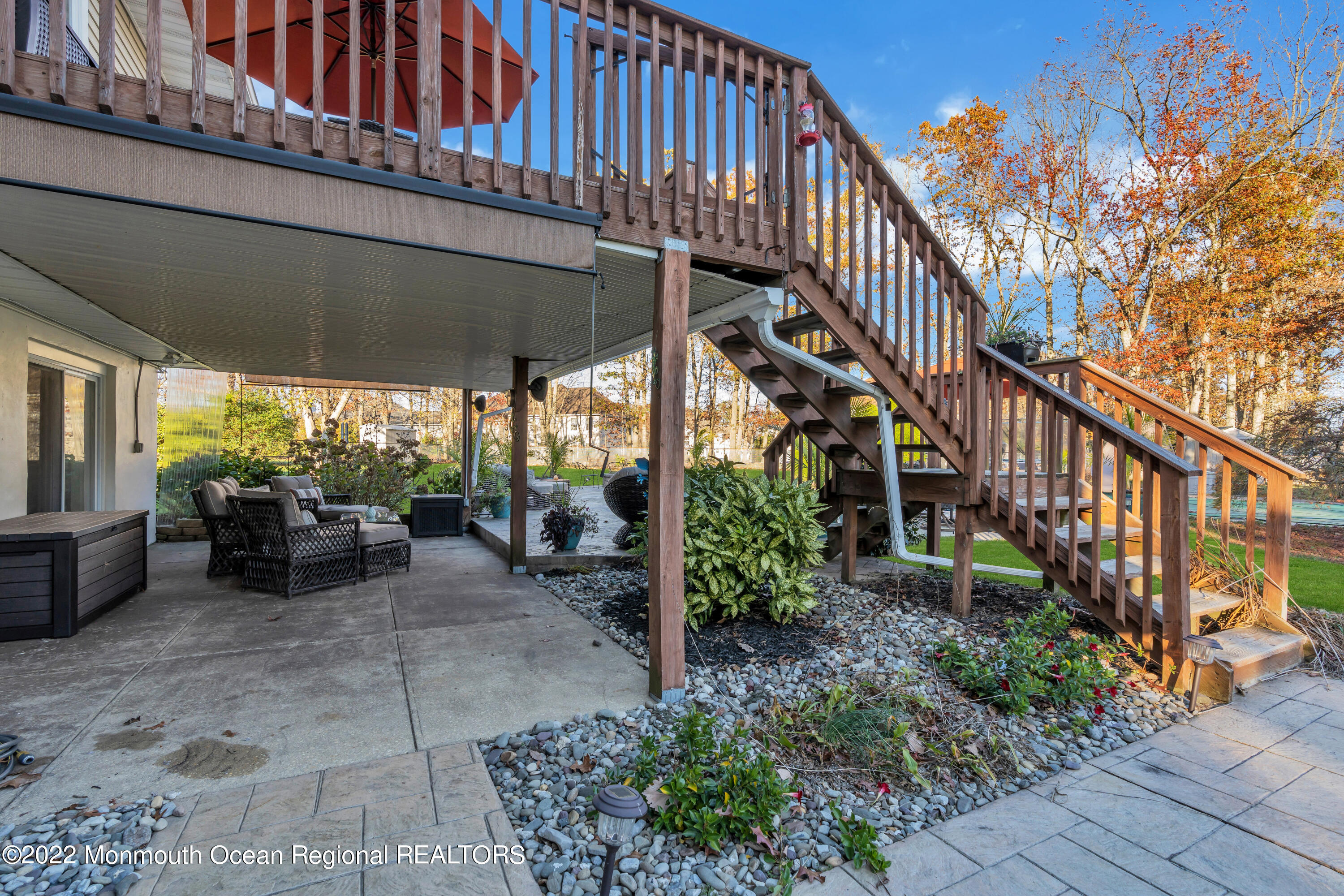 115 Greymoor Road Howell, NJ 07731 - Photo 35 of 38 a view of patio with table and chairs potted plants with wooden floor