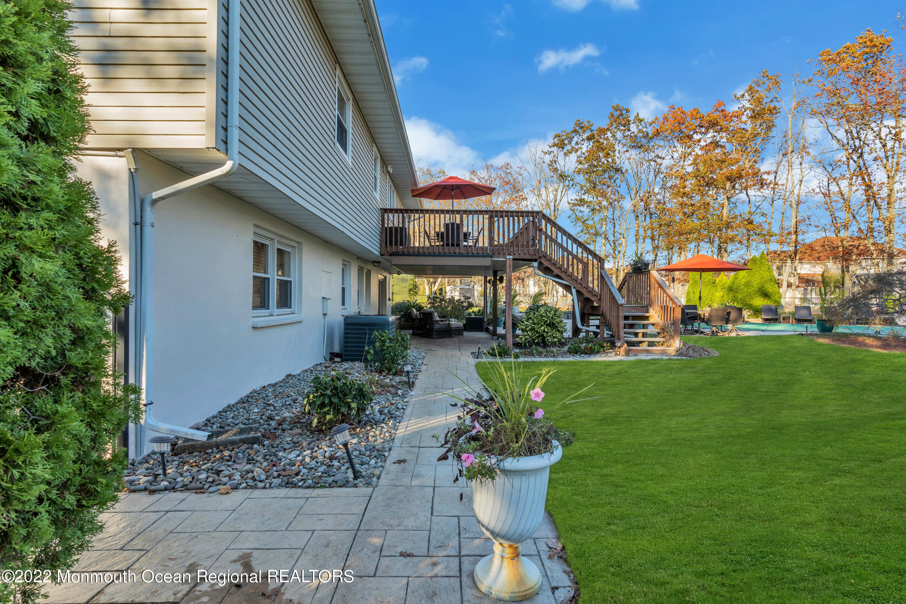 115 Greymoor Road Howell, NJ 07731 - Photo 36 of 38 a front view of a house with a garden