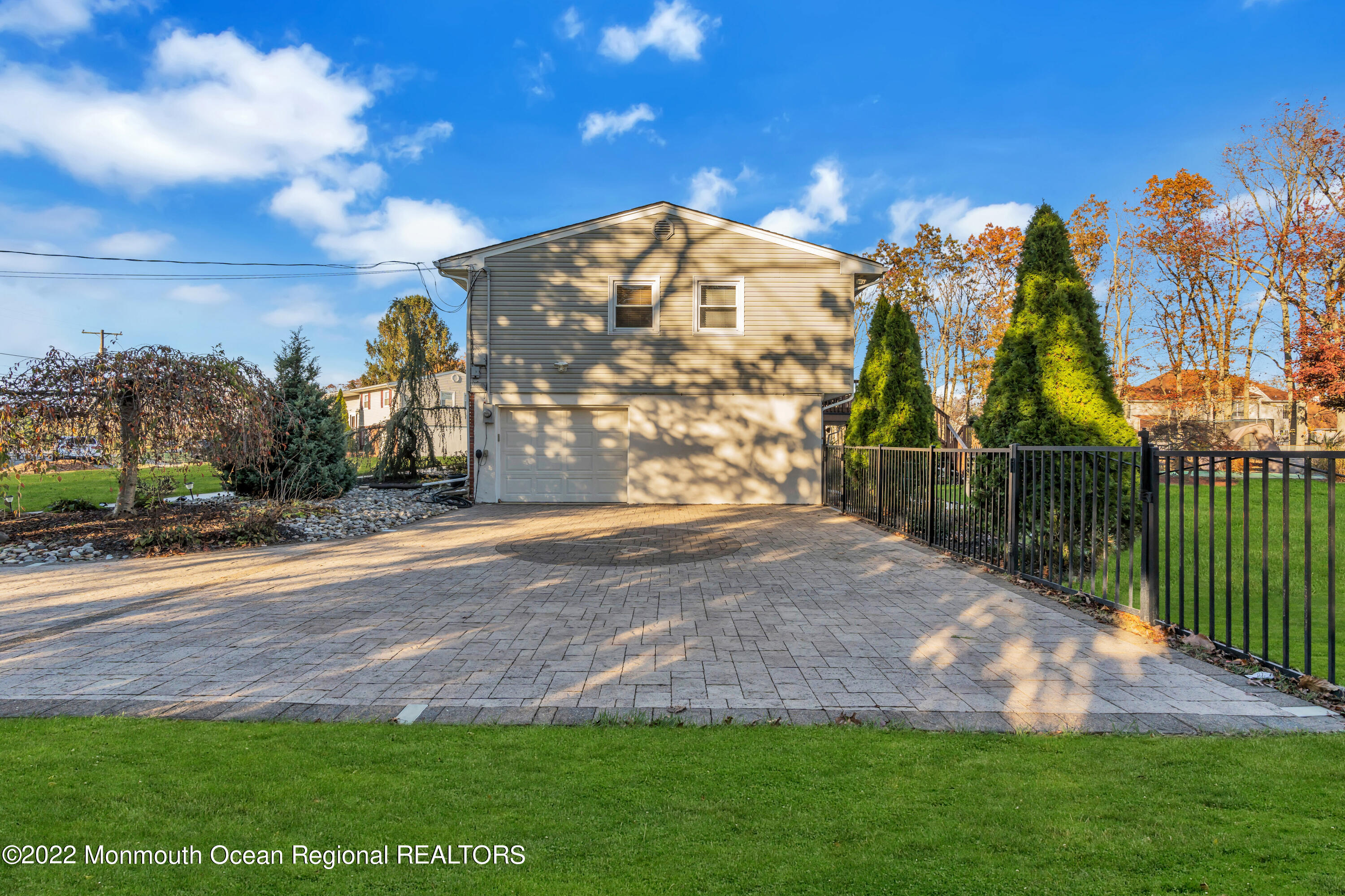 115 Greymoor Road Howell, NJ 07731 - Photo 37 of 38 a view of a yard with a house in the background