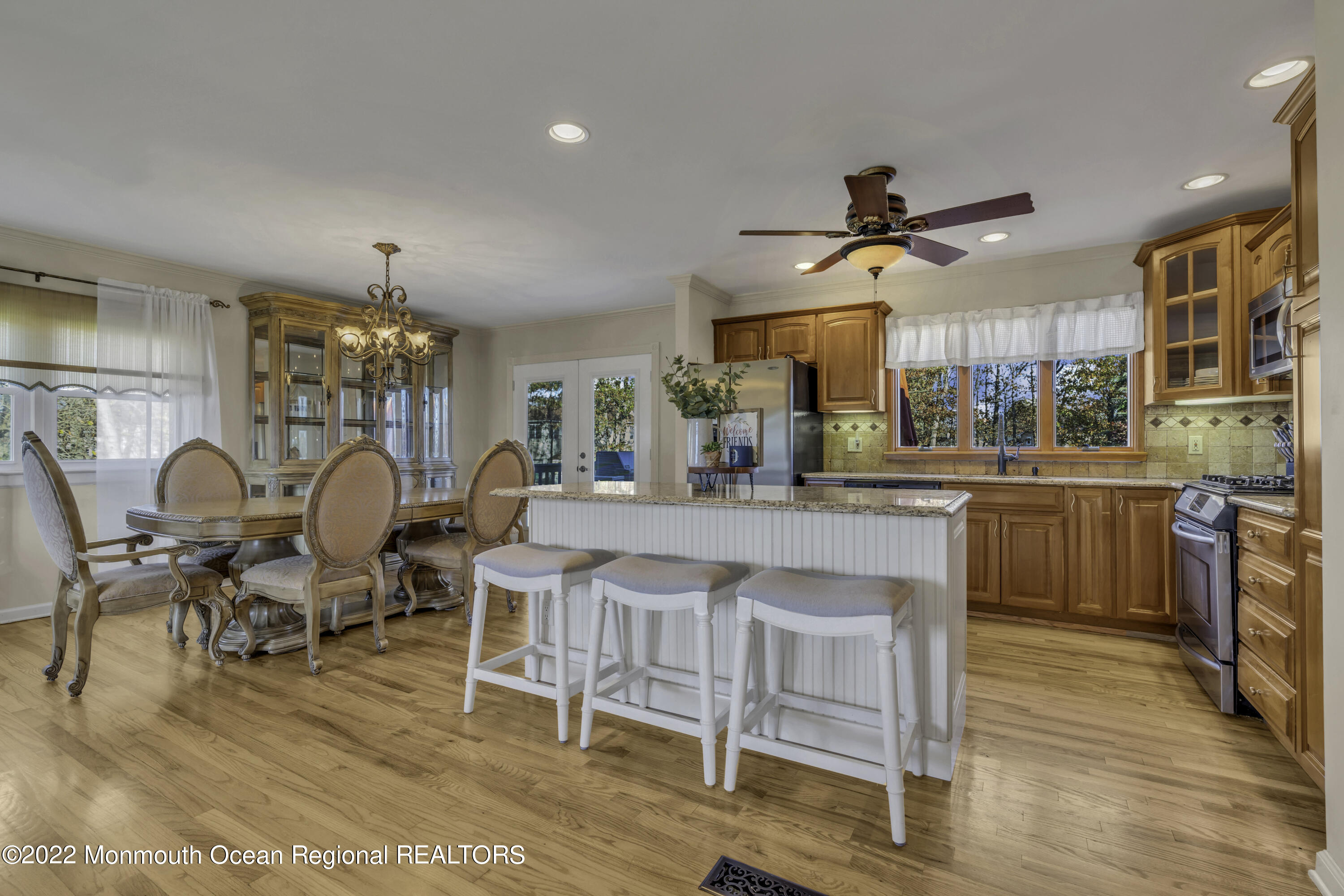 115 Greymoor Road Howell, NJ 07731 - Photo 5 of 38 a living room with lots of furniture kitchen view and a wooden floor