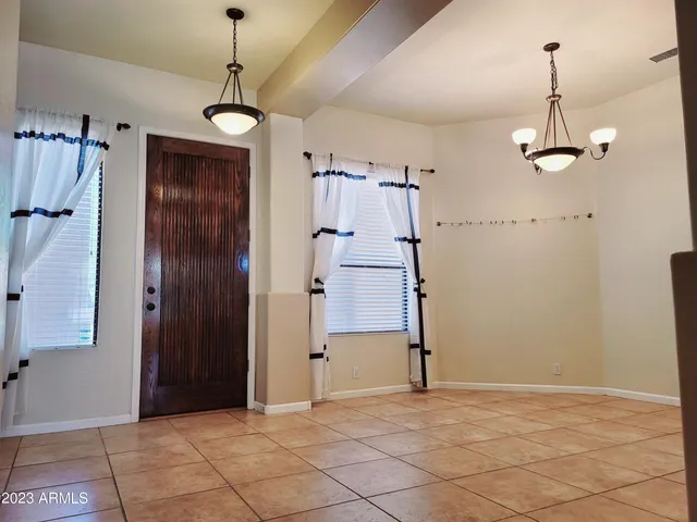 a view of empty room with a ceiling fan