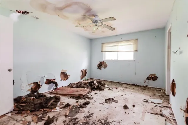 a bed room with a bed and a chandelier