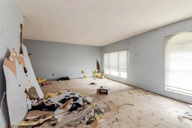 a bed room with a bed and a window