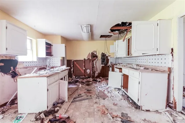 a view of a kitchen with sink dryer and washer