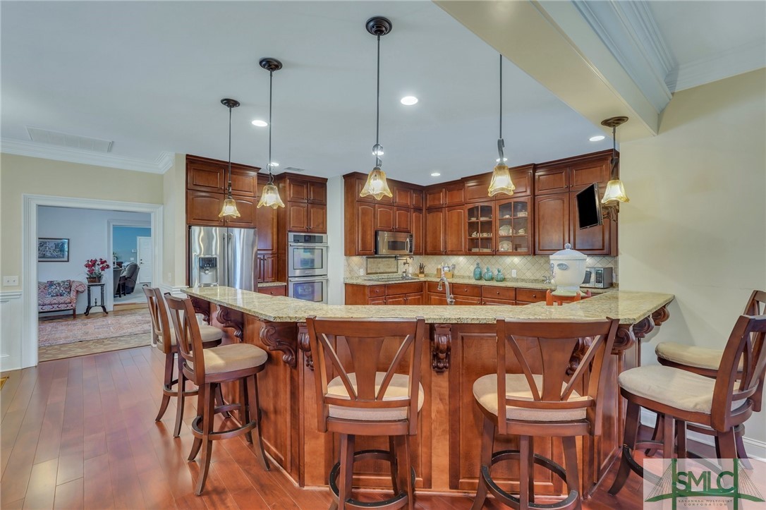 216 Oatland Island Road Savannah, GA 31410 - Photo 6 of 50 Kitchen with Granite Counters/Breakfast Bar