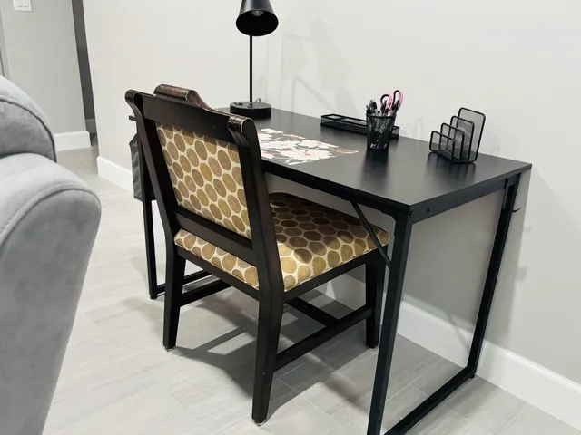 a view of a workspace with furniture