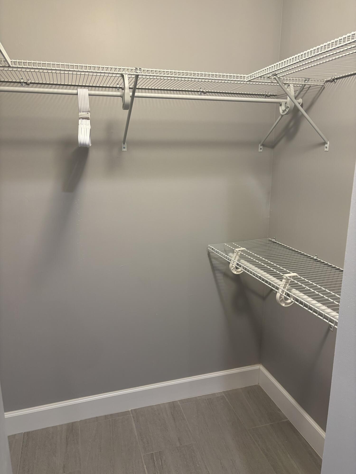 222 Southeast 3rd Street Boynton Beach, FL 33435 - Photo 26 of 40 a view of a room with racks on the wall