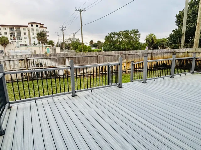 a view of a balcony with wooden floor