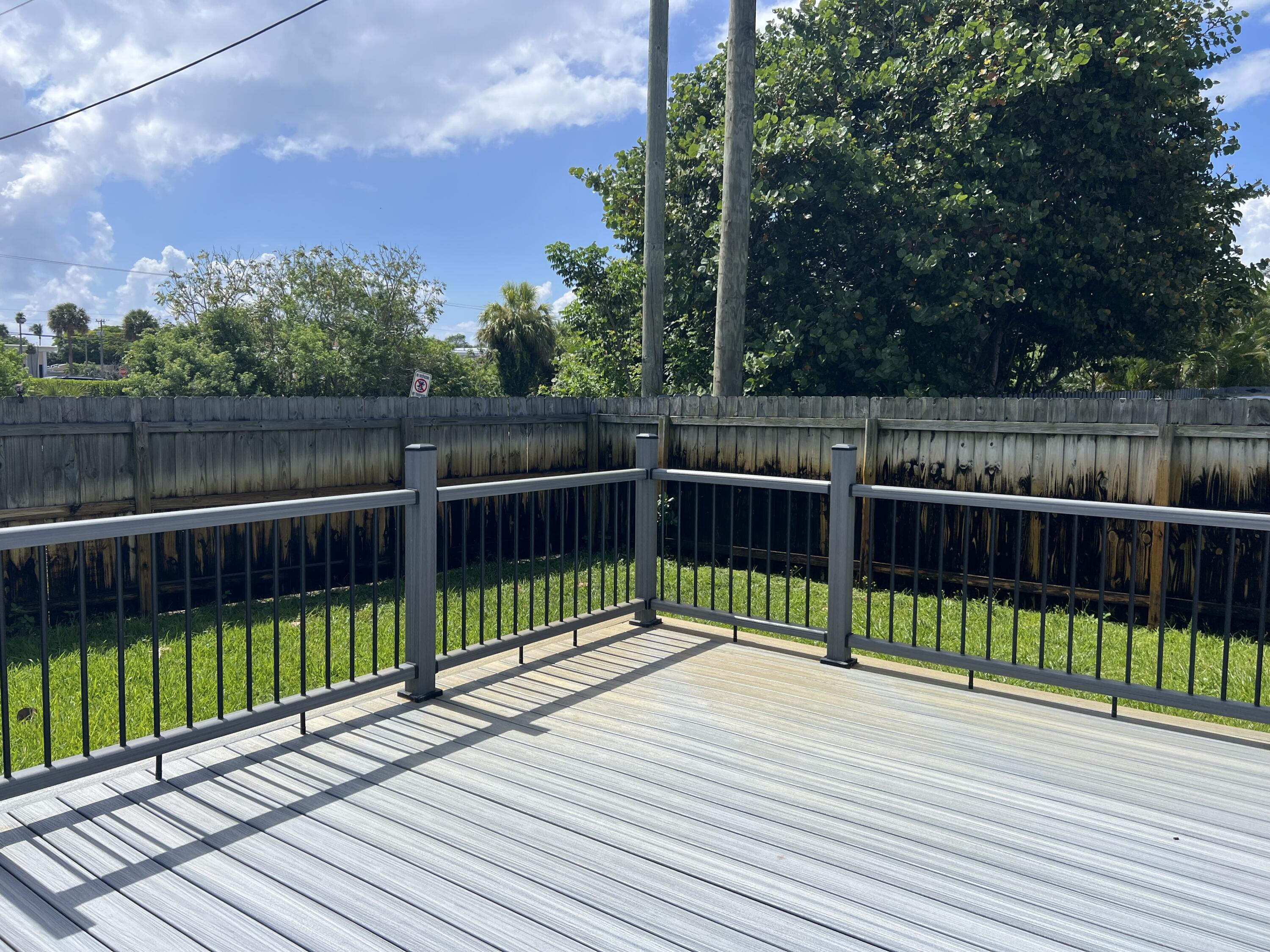 222 Southeast 3rd Street Boynton Beach, FL 33435 - Photo 35 of 40 a view of a deck with a large trees