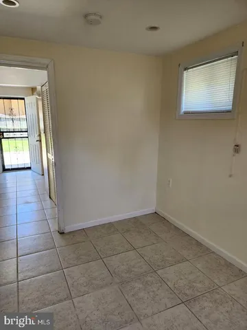 a bathroom with a shower and a sink