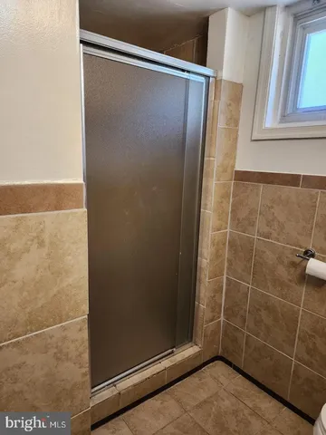 a bathroom with a sink toilet and mirror