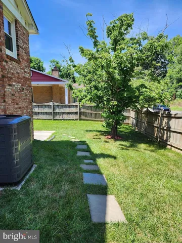 a view of a backyard with a tub