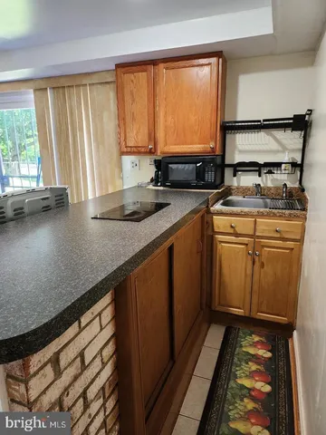 a kitchen with a stove and a sink