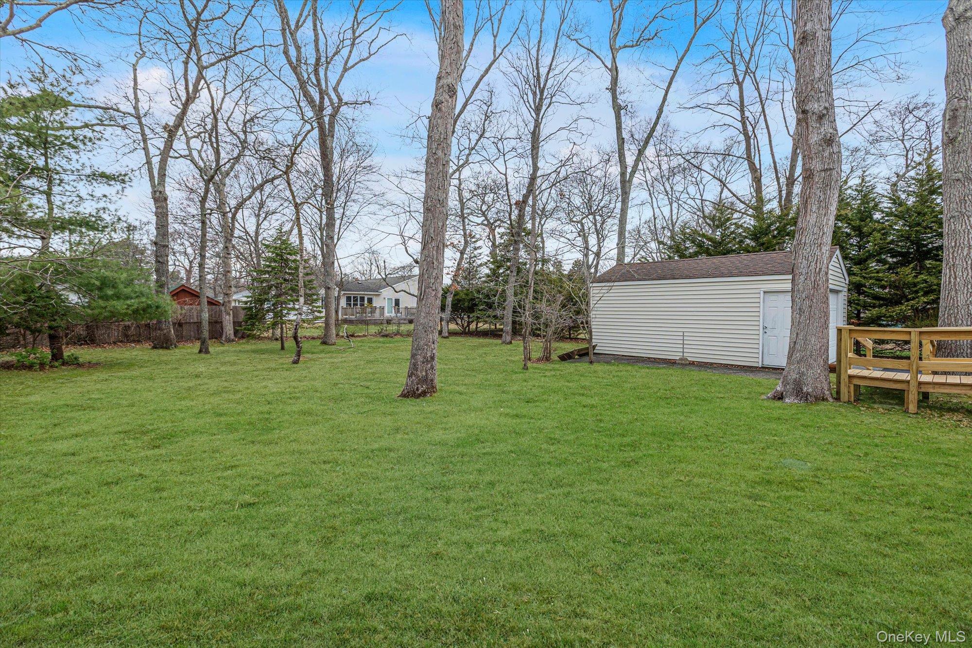 74 Country Club Road Bellport, NY 11713 - Photo 17 of 21 a view of a park with large trees
