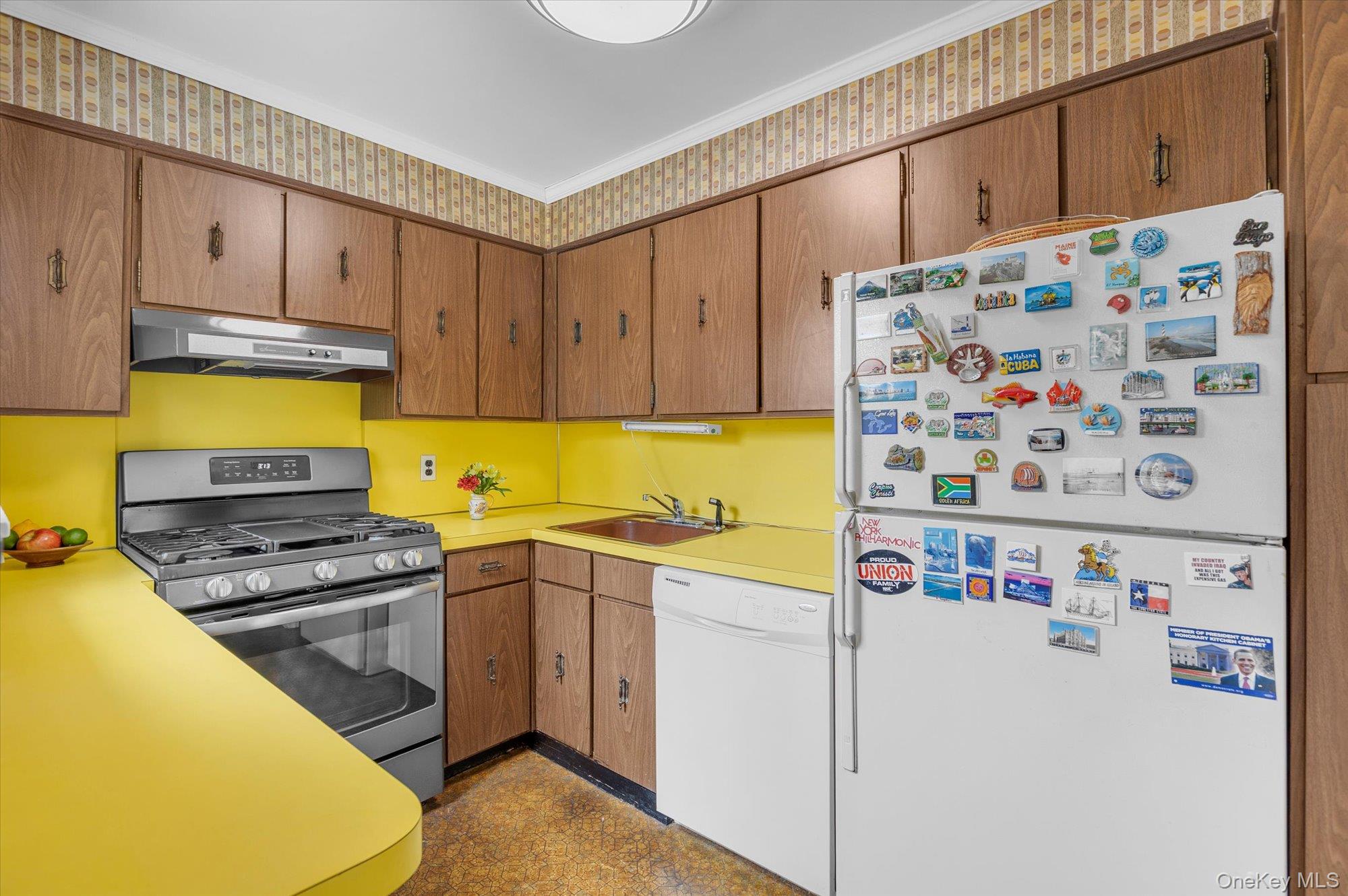 74 Country Club Road Bellport, NY 11713 - Photo 8 of 21 a kitchen with a refrigerator and a stove