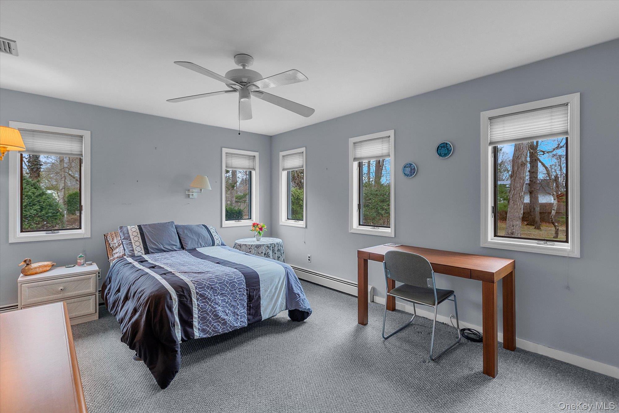 74 Country Club Road Bellport, NY 11713 - Photo 9 of 21 a bed room with a bed and a chair