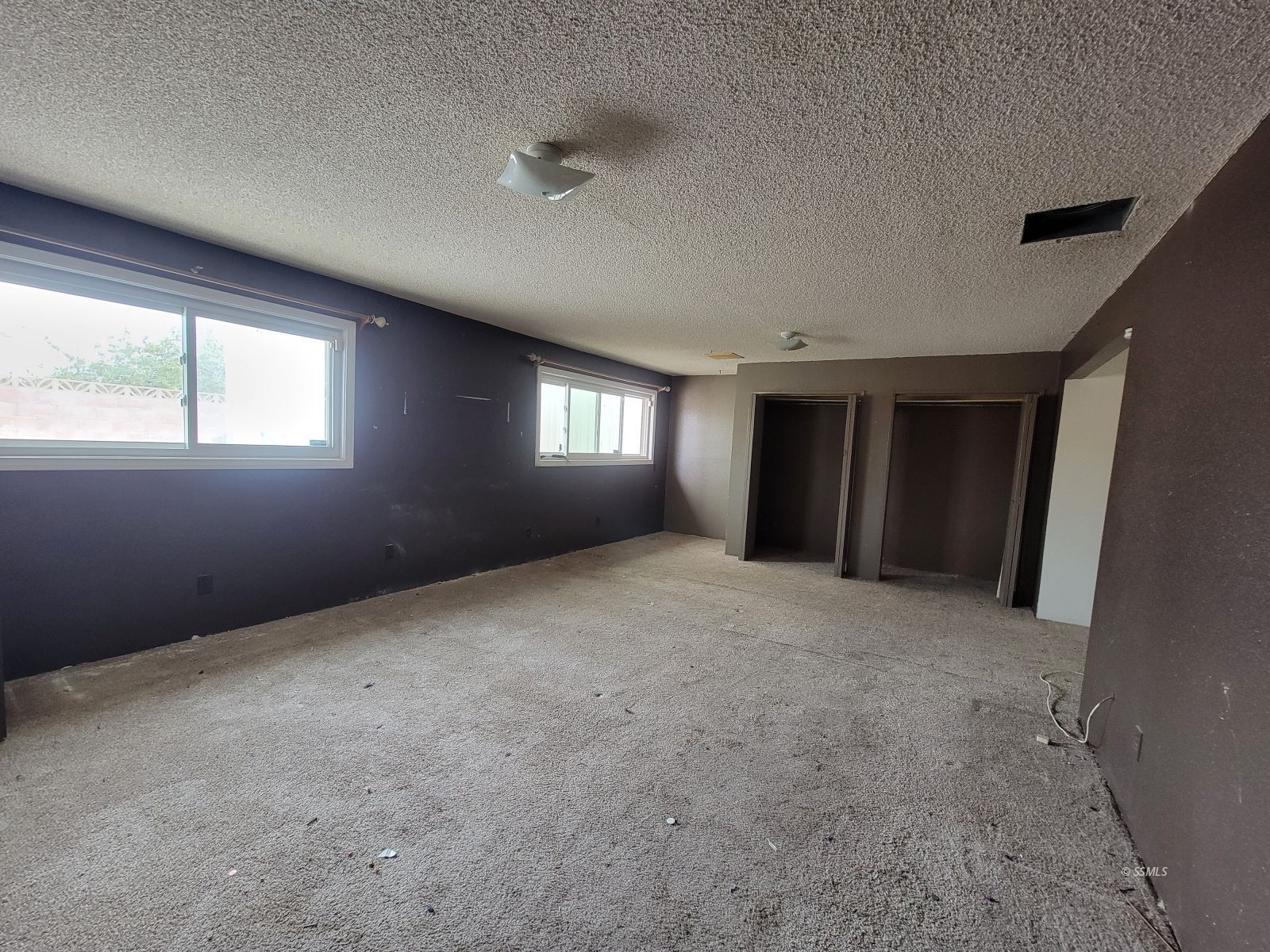 345 South Gordon Street Ridgecrest, CA 93555 - Photo 15 of 22 a view of an empty room with windows and closet