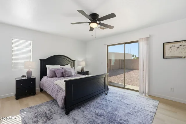 a bedroom with a bed and window