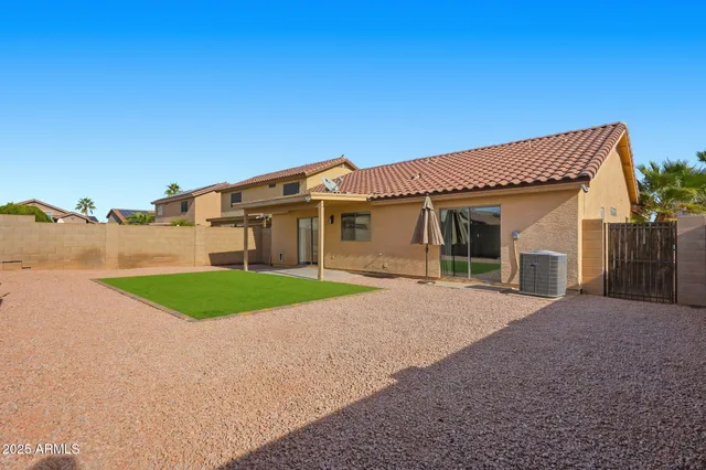 a front view of a house with garage and yard