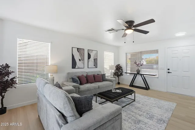 a living room with furniture and a window