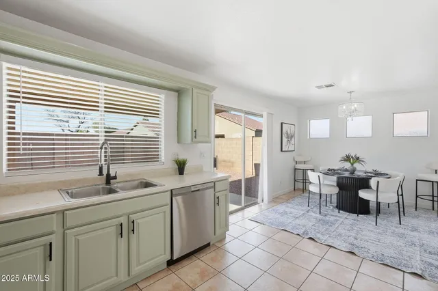 a kitchen with sink cabinets and window