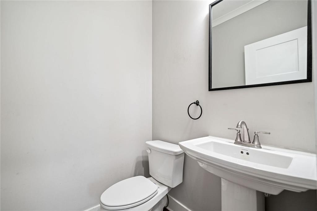 2 Village Ridge Jasper, GA 30143 - Photo 12 of 45 a bathroom with a toilet sink and mirror