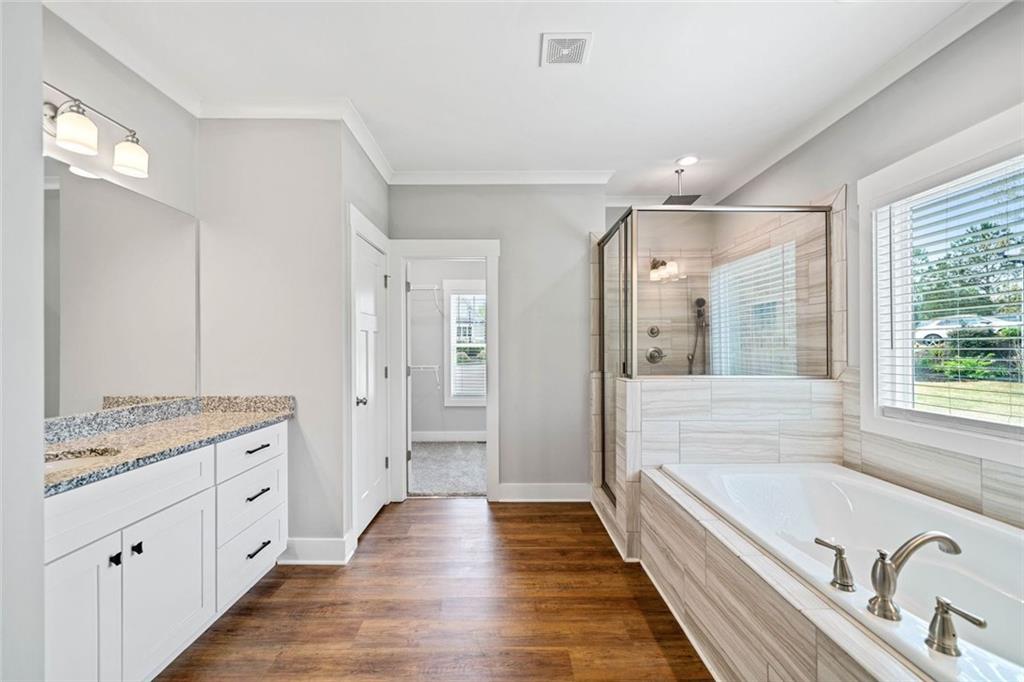 2 Village Ridge Jasper, GA 30143 - Photo 25 of 45 a spacious bathroom with a granite countertop tub shower double vanity and a mirror