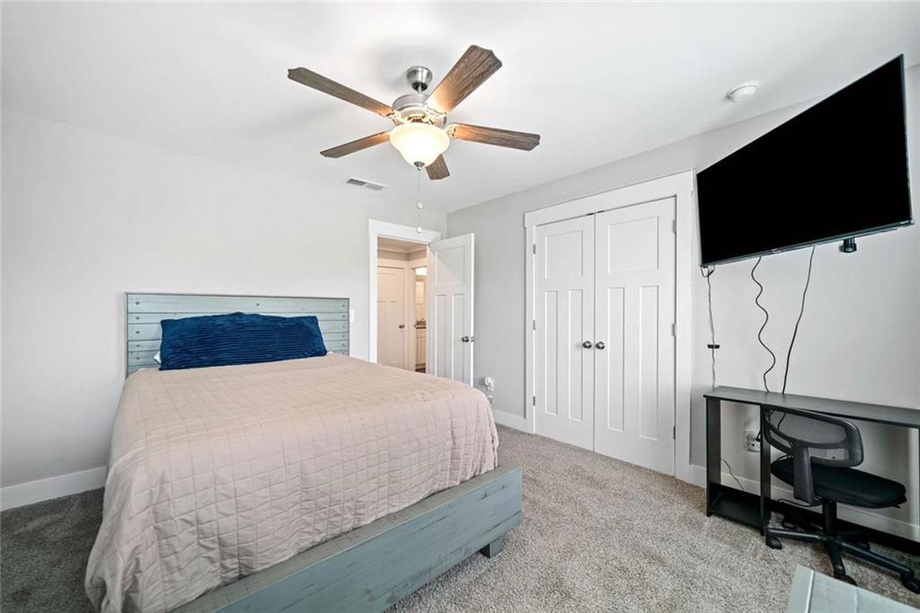 2 Village Ridge Jasper, GA 30143 - Photo 28 of 45 a bedroom with a bed and a flat screen tv