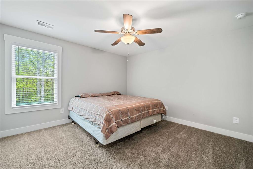 2 Village Ridge Jasper, GA 30143 - Photo 30 of 45 a spacious bedroom with a bed and a window