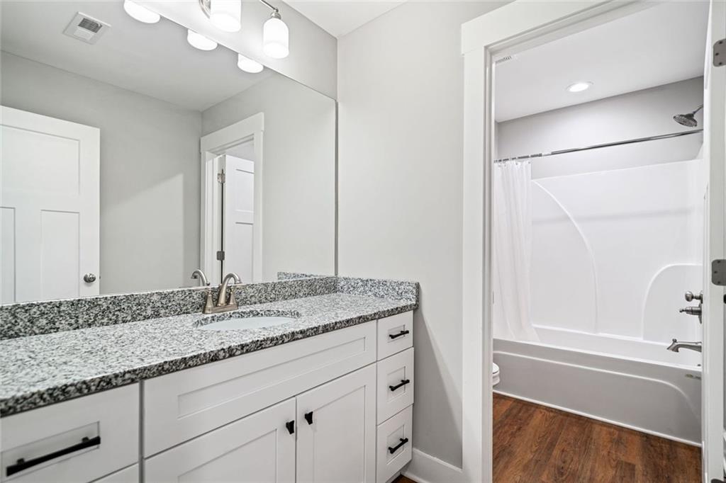 2 Village Ridge Jasper, GA 30143 - Photo 32 of 45 a bathroom with a granite countertop sink and a mirror